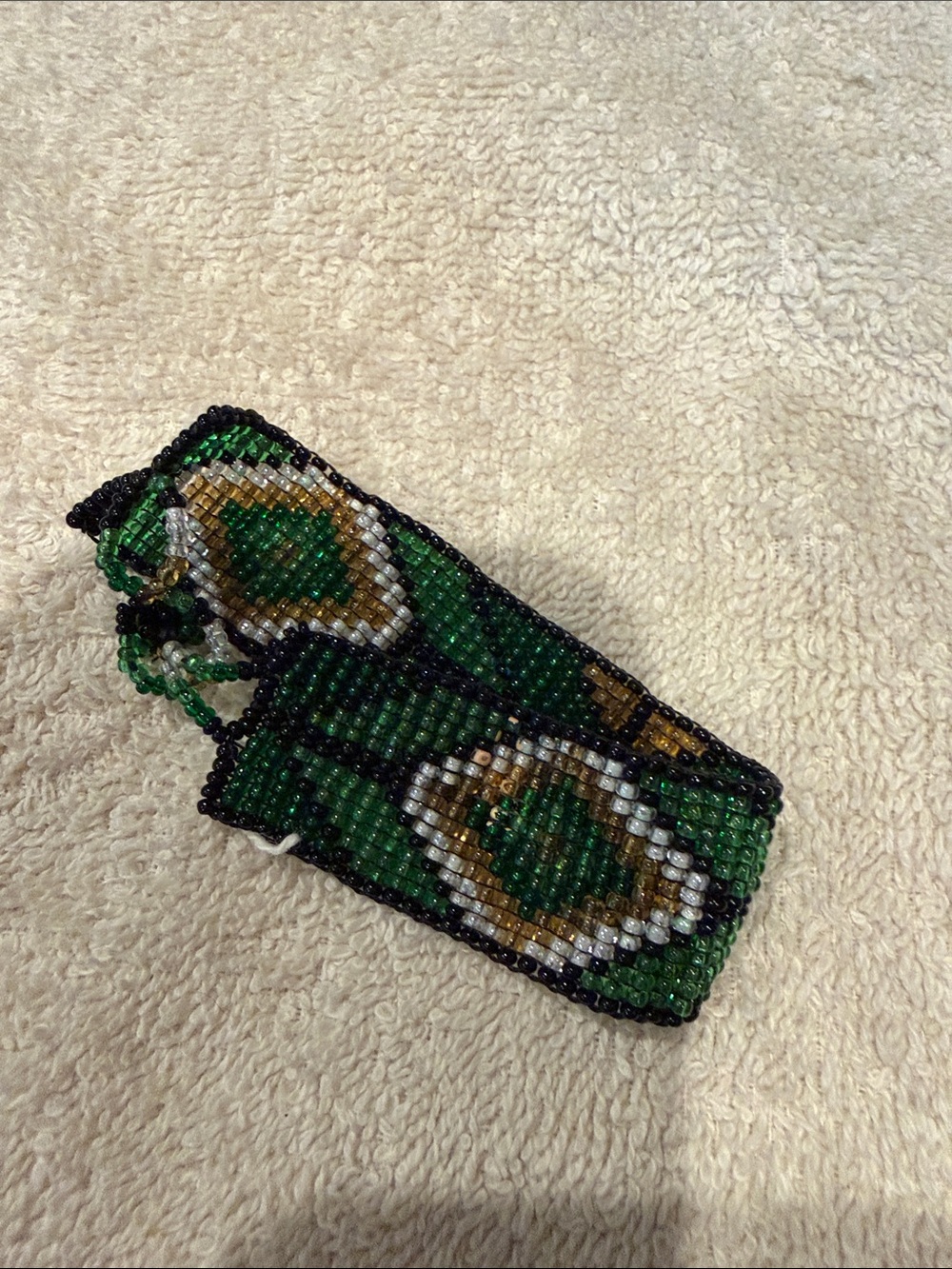 Handmade Green Beaded Bracelet with Eye Motif.  7 1/2” length